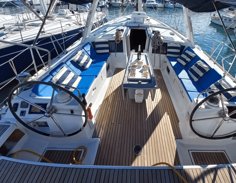 Barcelona: 2-Hour Sailboat Tour with Snacks and Drinks - Harbor glam first: One Ocean Marina, Columbus, and the big drawbridge
