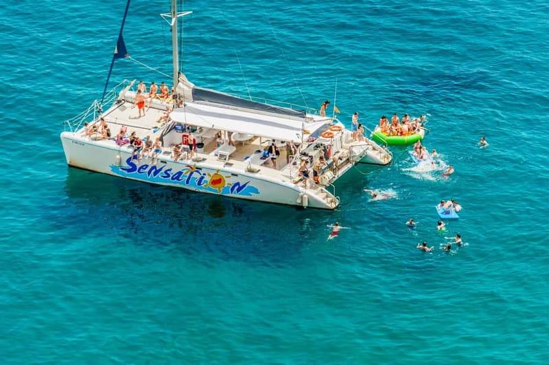 Barcelona: Catamaran Party Cruise with BBQ Meal - Leaving Port Olímpic: your deck time before the sea break