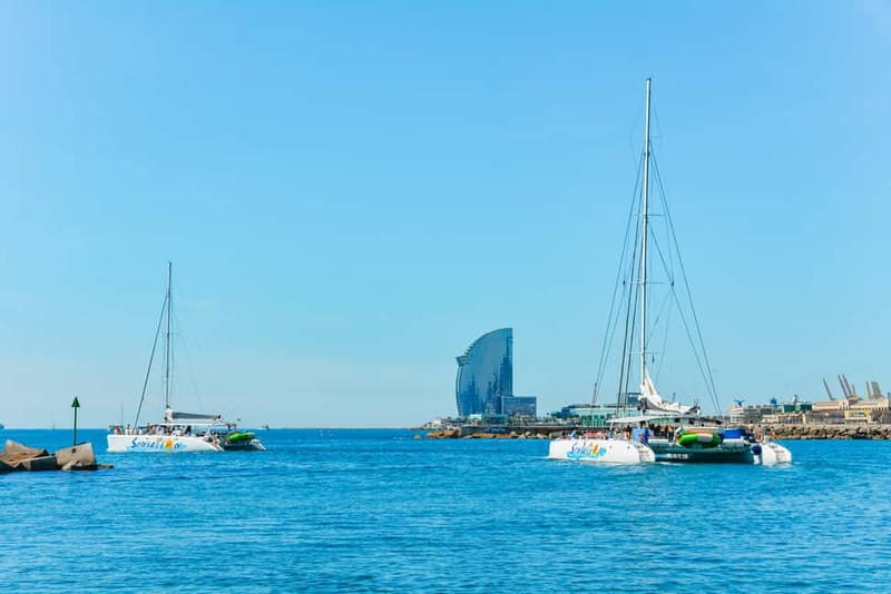 Barcelona: Catamaran Party Cruise with BBQ Meal - Drinks that come after swimming: unlimited soft drinks plus two alcoholic options