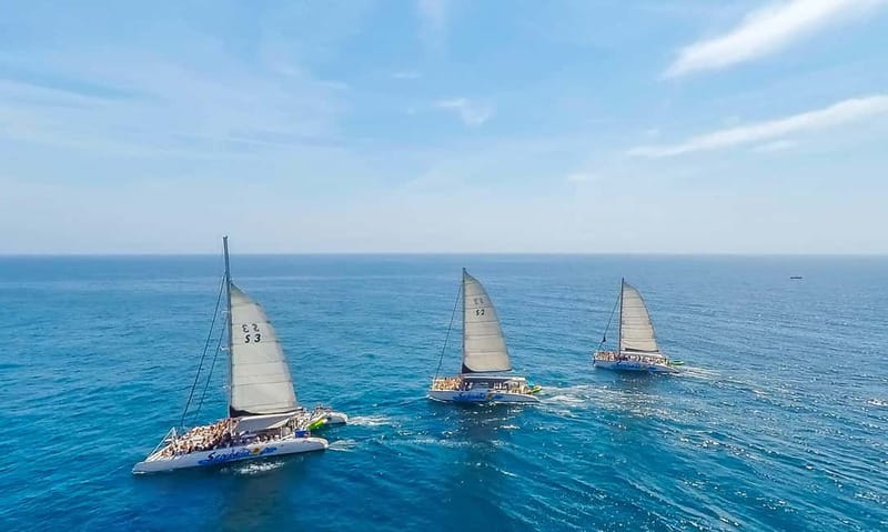 Barcelona: Catamaran Party Cruise with BBQ Meal - The 3-hour rhythm: cruise first, swim near Badalona, then BBQ with the party