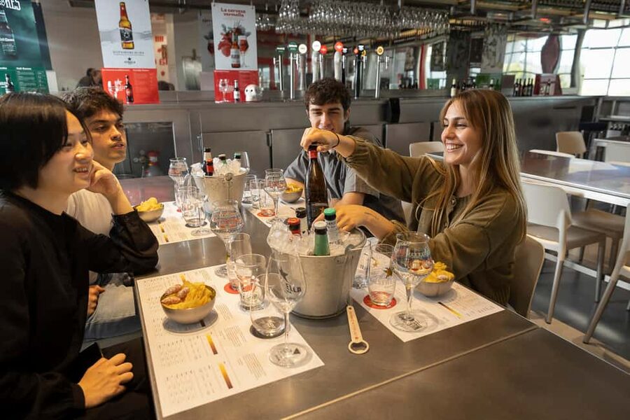Barcelona: Estrella Damm Brewery Guided Tour with Tasting - Entering the Estrella Damm brewery in El Prat, a straightforward beer education