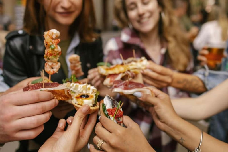 Barcelona: Food Walking Tour with Tapas and Wine - 9 tapas and 4 drinks, served with priority reservations