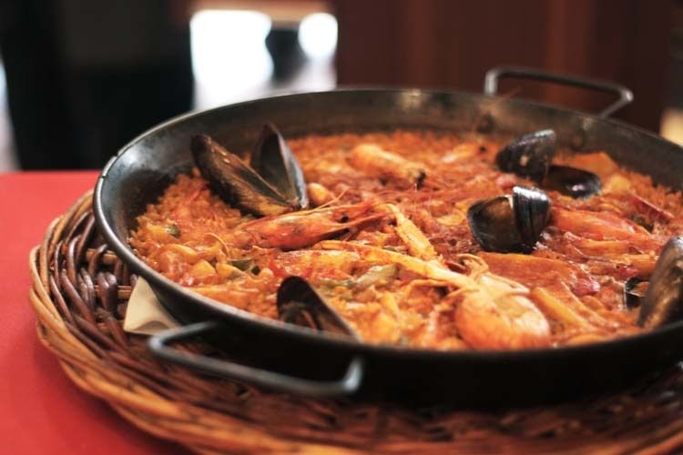 Barcelona: Old Town Tapas & Paella Food Tour with 8 Tastings - Market lesson: Iberian ham, cheeses, and seasonal produce