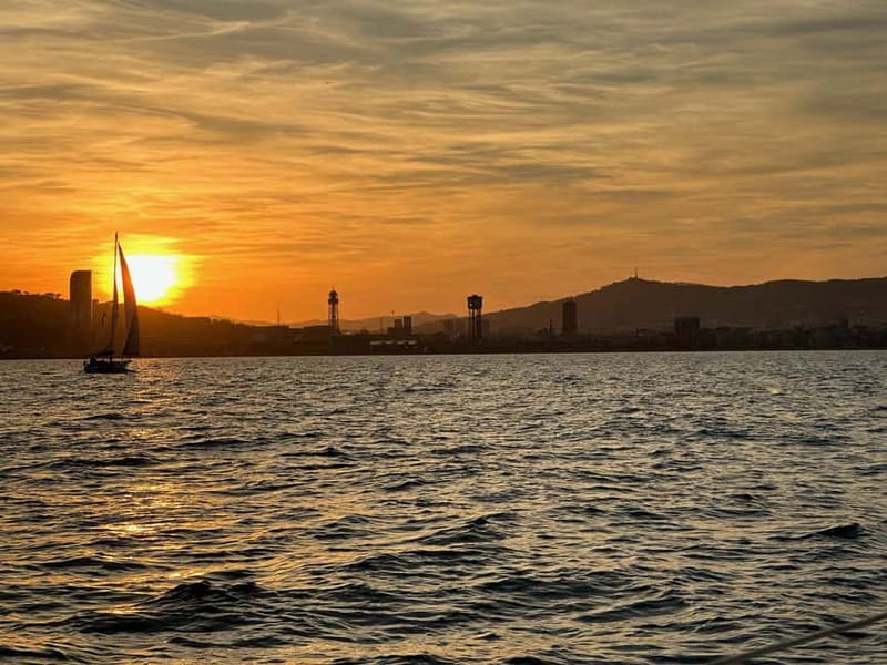 Barcelona: Sunset Sailboat Cruise with Open Bar and Snacks - Barceloneta Beach: the core sunset hour