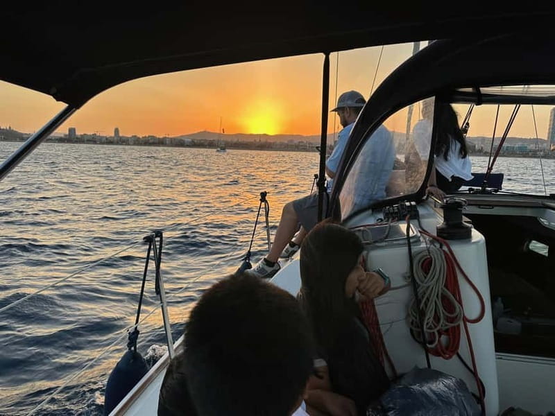 Barcelona: Sunset Sailboat Cruise with Open Bar and Snacks - Open bar vibes: cava, juices, water, and the little care details
