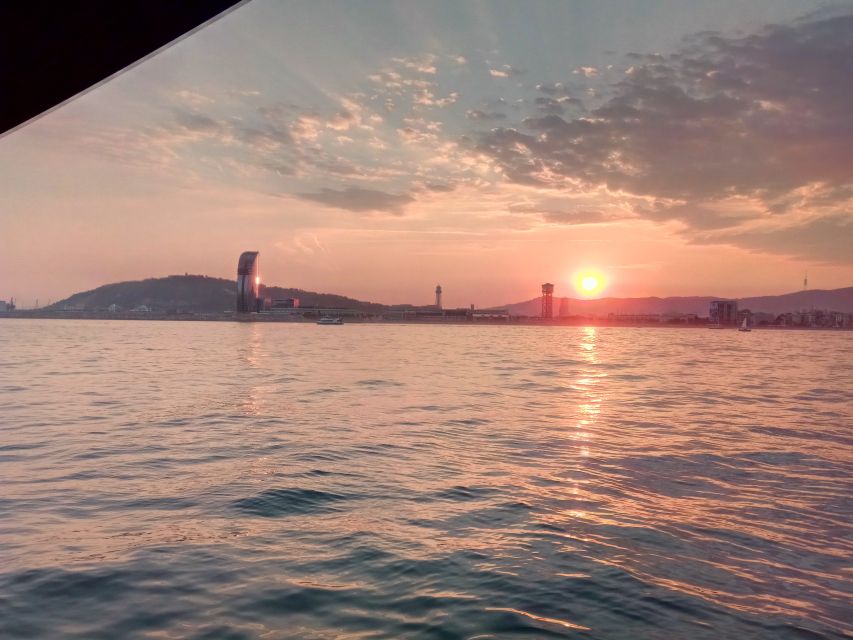 Barcelona: Sunset Sailing Tour with Open Bar & Snacks - Sunset sailing from Port Olímpic, not a landlocked viewpoint