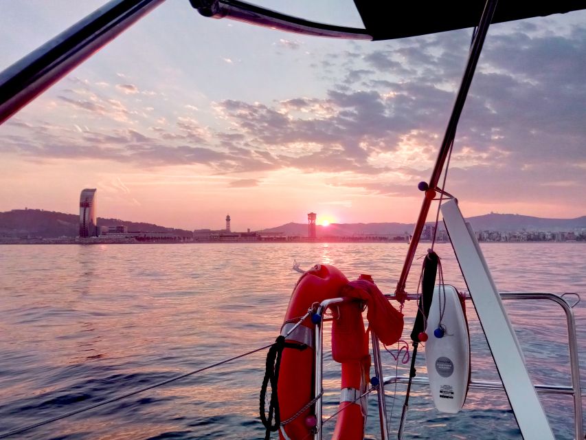Barcelona: Sunset Sailing Tour with Open Bar & Snacks - The anchor stop and your short swim, with wildlife as a bonus