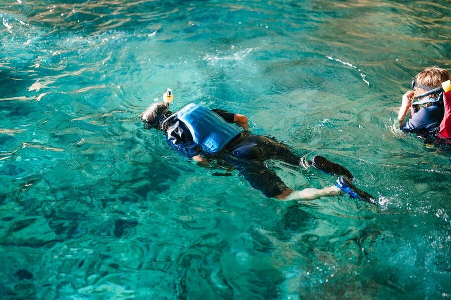Cala Varques: Guided Sea Caves Kayak & Snorkeling Expedition - Support boat, cliff jumping, and staying safe with a busy coast