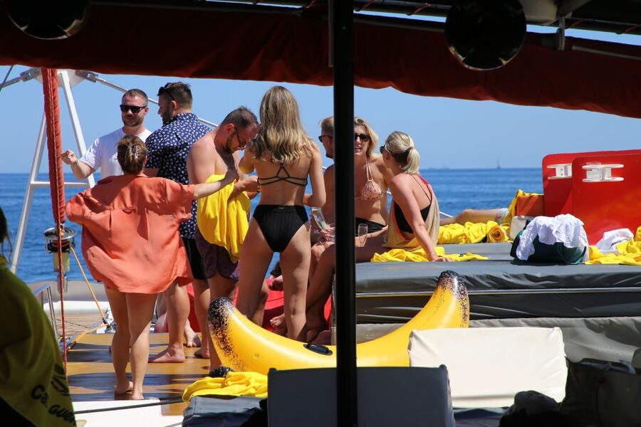 Cambrils: Catamaran Cruise with Drinks and BBQ Lunch Option - The onboard vibe: sun and shade, chill music, and not feeling packed