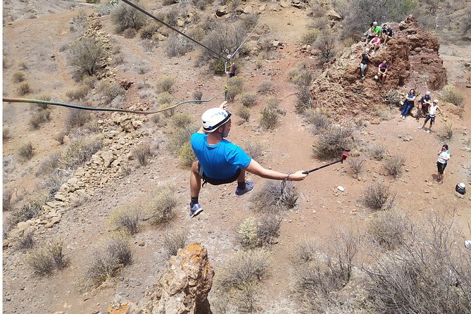 Climbing + Zipline + Via Ferrata + Cave. Adventure route in Gran Canaria - The Volcanic Tube Cave: Head Torch, Belly Crawl, and Boundary Testing