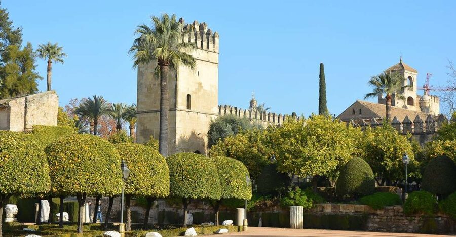 Cordóba: Gardens & Fortress of Catholic Monarchs Guided Tour - Entering a Palace-Fortress Built on a Caliph’s Past