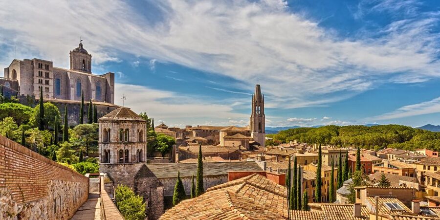 From Barcelona: Girona, Figueres, Dalí Museum, and Cadaqués - Girona’s Jewish Quarter and medieval streets, with a guide who helps you read them