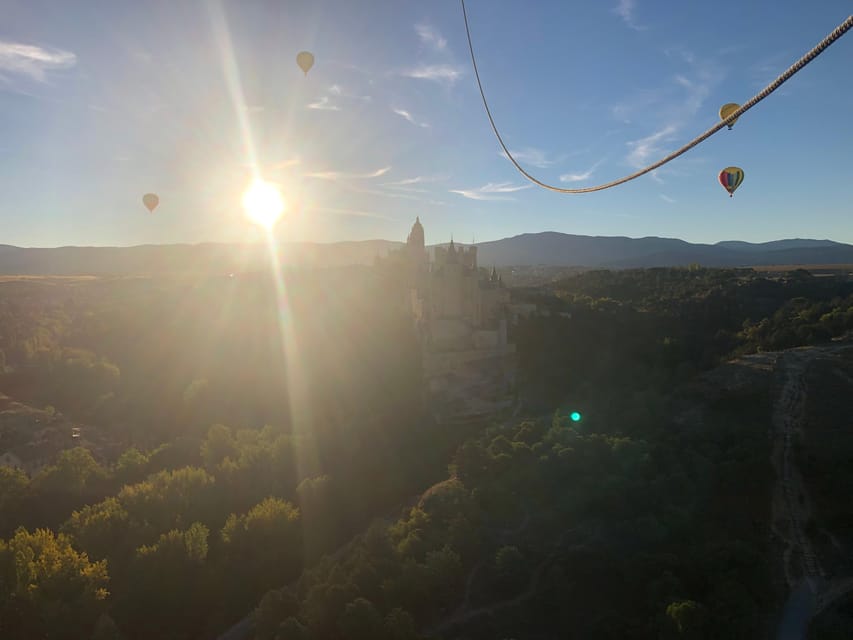 From Madrid: Hot Air Balloon over Segovia with Transfer - After landing: champagne toast, picnic in Segovia, and a signed keepsake
