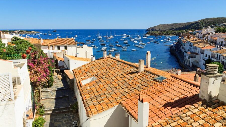 From Roses: Costa Brava Boat Tour to Cadaqués - Your coastal “between stops” moment: using the audio guide on a phone