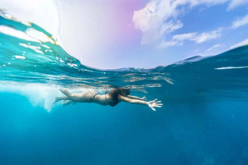 Gran Canaria: Catamaran Tour with Lunch on Pristine Beaches - Snorkeling, marine life viewing, and paddle boards: active, not hectic