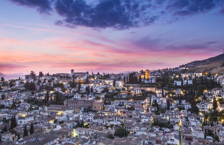 Granada: Albaicin and Sacromonte Evening Walking Tour - Albaicín by moonlight: walls, gates, and flowered balconies