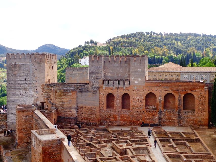 Granada: Alhambra Complex Guided Tour with Ticket - Carlos V Palace: the Christian-era contrast inside Alhambra walls