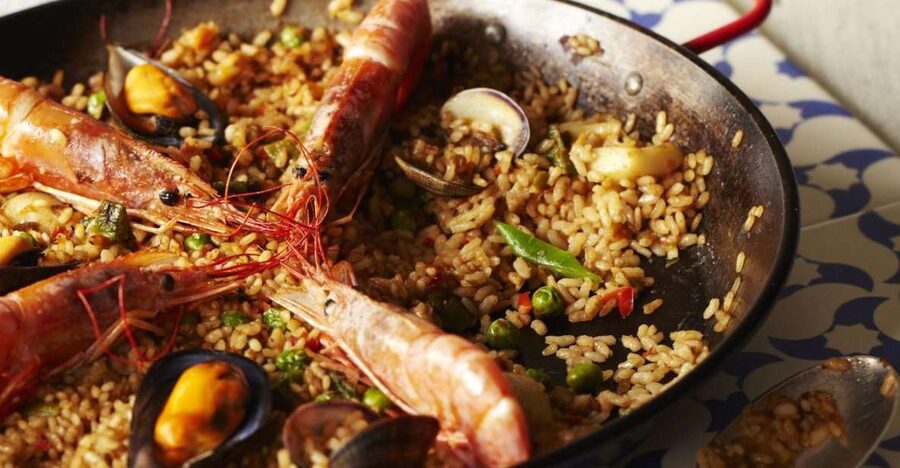 Half-Day Spanish Cooking Class & Boqueria Market Tour - Cooking a four-course Catalan tapas meal in real time