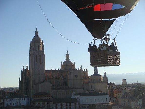 Hot-Air Balloon Ride over Segovia with Optional Transport from Madrid - Landing is part of the show: balloon packing, certificate time, and that cava toast
