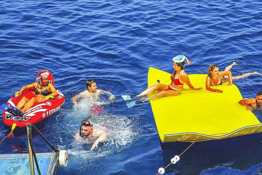 Ibiza: Beach Hopping Cruise w/ Paddleboard, Food, & Drinks - Onboard Comfort, Water Slides, and Spaces to Chill