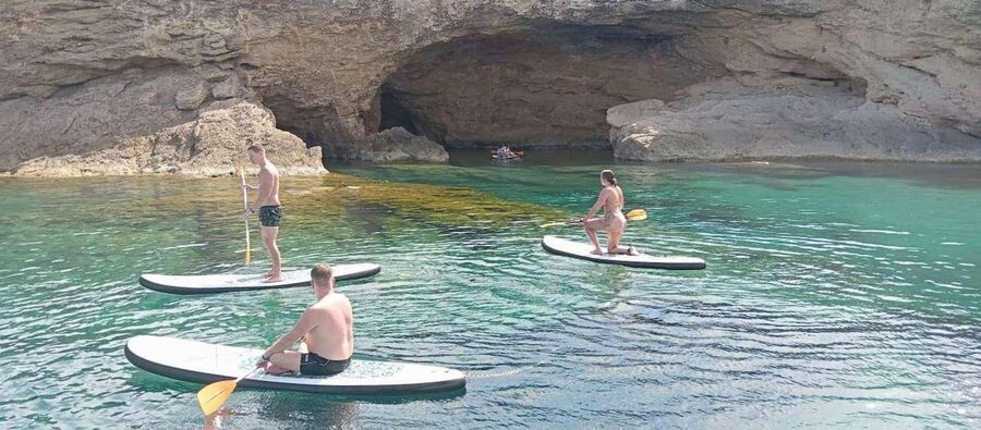 Ibiza: Snorkeling, Sunset Beach and Cave Boat Trip - Secret sunset stop on the water, with Cava and an open-bar vibe