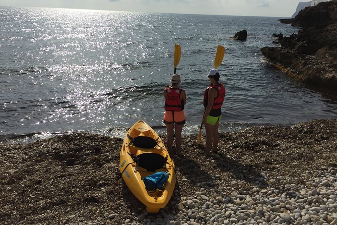 Kayak and snorkel excursion to Cova Tallada - Lantern-lit cave interior and a snack break