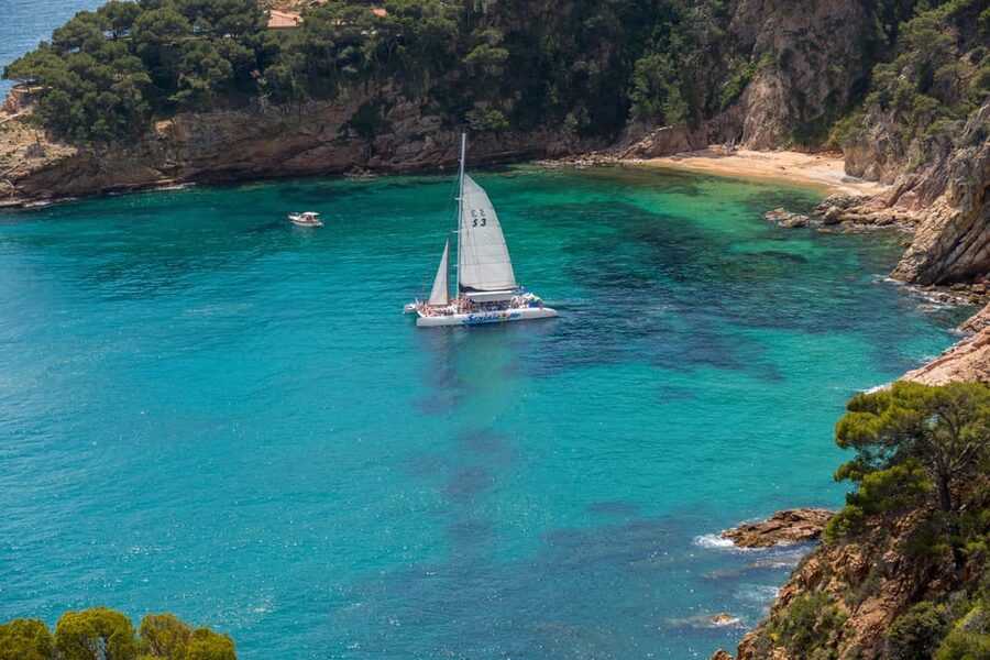 Lloret de Mar: Catamaran Sailing Cruise with BBQ and Drinks - The Sail Out From Lloret: Music, Sea Air, and Coastal Passes