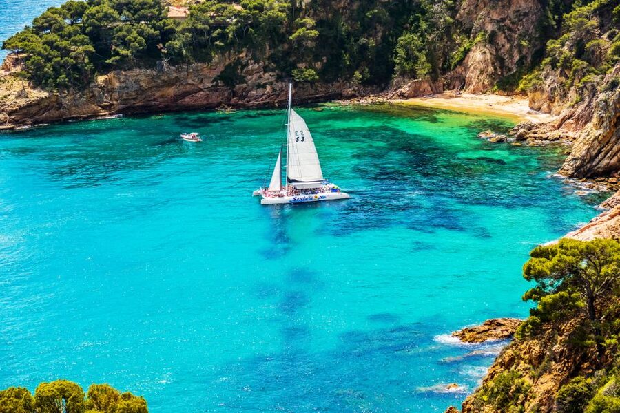 Lloret de Mar: Catamaran Sailing Cruise with BBQ and Drinks - Music, DJ Energy, and the Return Party Feeling