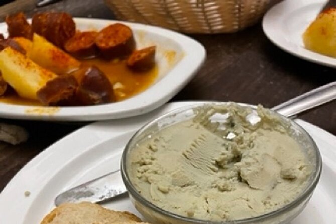 Madrid by Night Small Group Tour: Stories, Sights and Tapas Bites - Four bars and a menu that moves across Spain