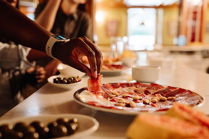 Madrid Tapas & Taverns Small Group Food & History Tour - The guided landmark walk: Royal Palace area and the Habsburg neighborhood