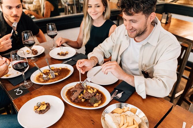 Madrid Tapas & Wine Tour with Rooftop Views and Local Guide - Calle de las Huertas: meat cheeks, smashed potatoes, and a red-wine moment