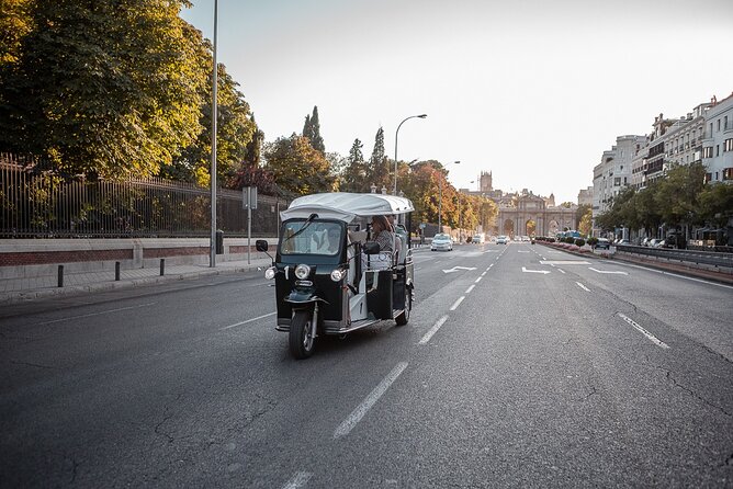 Madrid Welcome Tour with Local Guide in Eco Tuk Tuk Private - Cibeles and Neptune fountains: sports mythology, Greek gods, and a planned rivalry