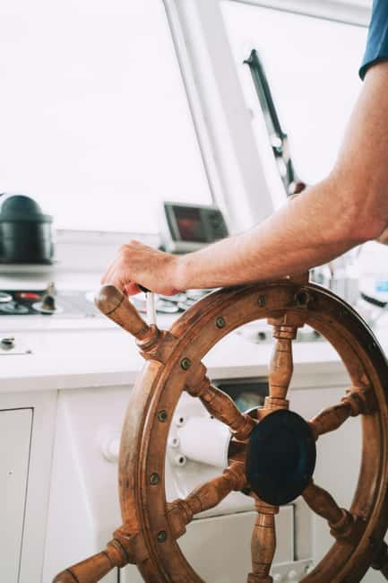 Menorca: Coves and Beaches Boat Trip w/ optional Paella - Entering the Menorca Blava experience at Passeig des Moll