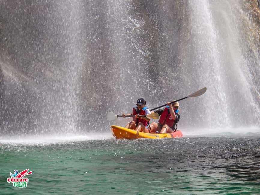 Nerja: Free kayaking route (without a tour guide). 2.5-hour tour. Nerja-Maro Waterfall. - Entering Burriana Beach: meeting point, lockers, and the safety setup