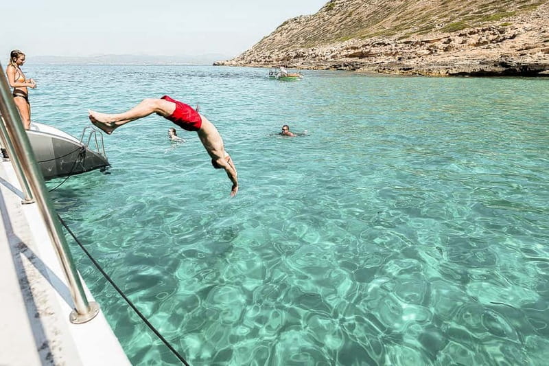 Palma de Mallorca: Half-Day Catamaran Tour with Buffet Meal - Daytime vs sunset cruises: DJ energy and timing differences
