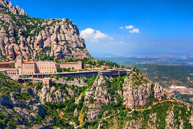 Sagrada Familia & Montserrat Small Group Tour with Hotel pick-up - Montjuic First Stop: Olympic Bones, City Views, and Garden Breaks