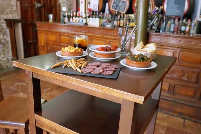 Sevilla Food Tour: Tapas, Wine, History & Traditions - Santa Cruz finish: albóndigas, pestiños, and PX in a patio