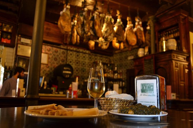 Sevilla Food Tour: Tapas, Wine, History & Traditions - Los Soportales for chicharrones, montaitó, and barrel beer