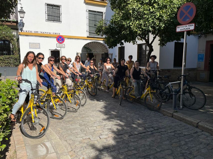 Seville: Relaxing City Bike Tour with a Tour Guide - Along the Guadalquivir: Torre del Oro and panoramic water views
