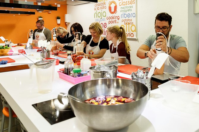 Spanish Cooking Class Paella Tapas and Sangria in Madrid - Evening Tapas Cooking Class: Garlic Shrimp, Chorizo in Cider, Patatas Bravas, and Crema Catalana