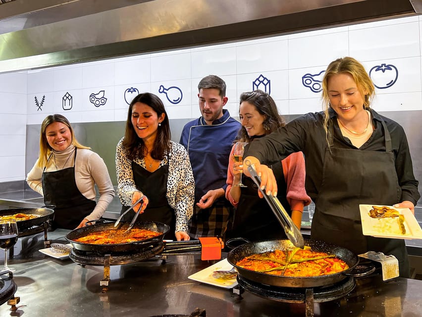 Valencia: Paella Cooking Class with Central Market Tour - The kitchen setup: your station, the chef’s pace, and real group energy