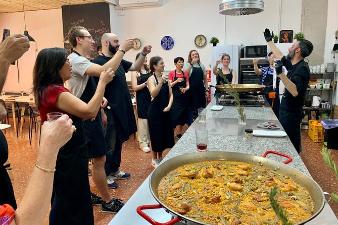 Valencian paella cooking class, tapas and visit to Ruzafa market. - Chicken and rabbit paella: hands-on cooking, step-by-step guidance